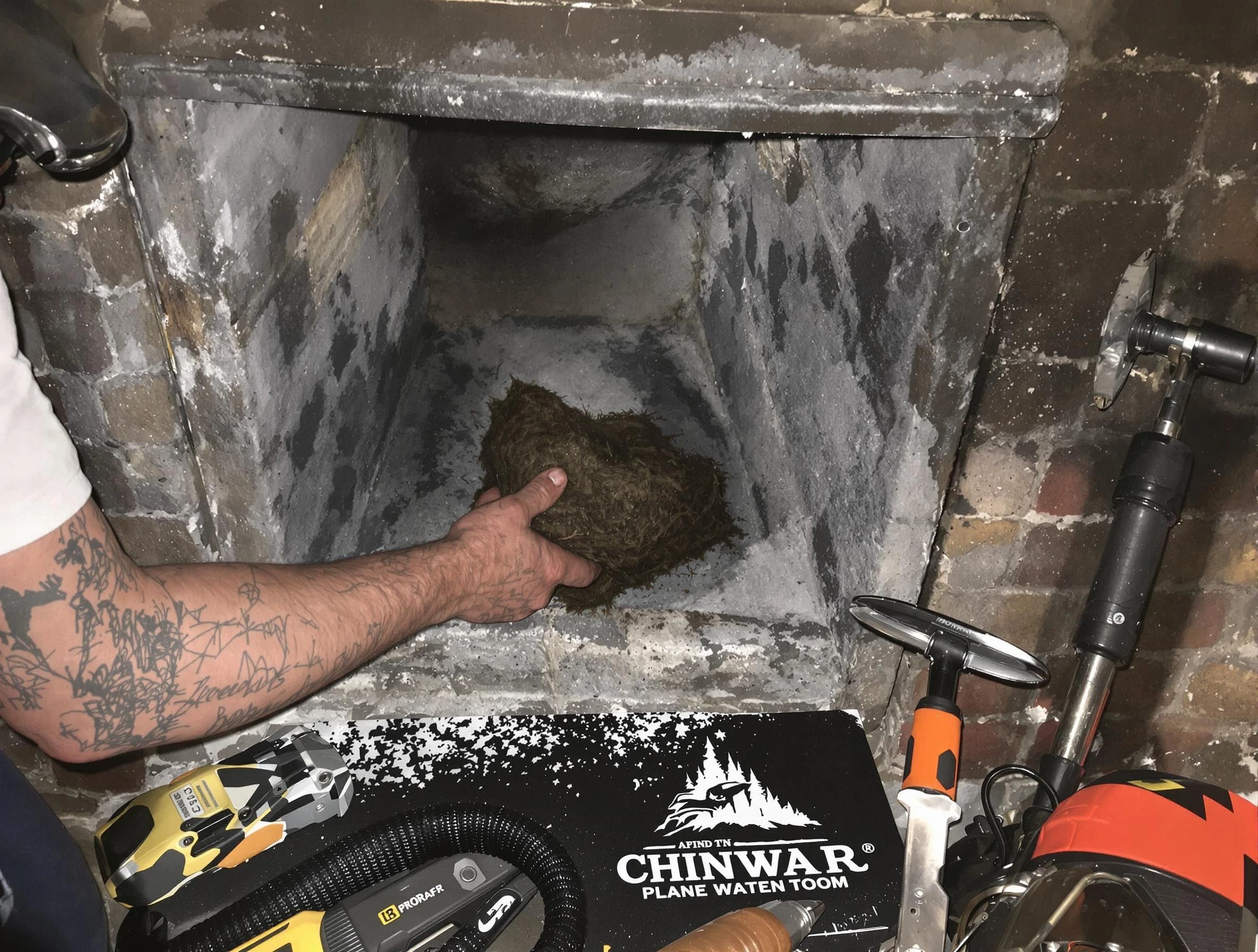 Norcross Chimney Sweep safely removing debris and screening chimney in Norcross, GA